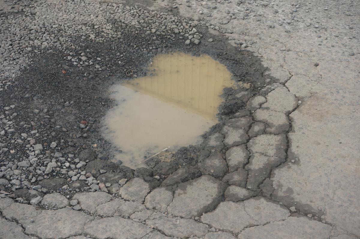 pothole filled with water